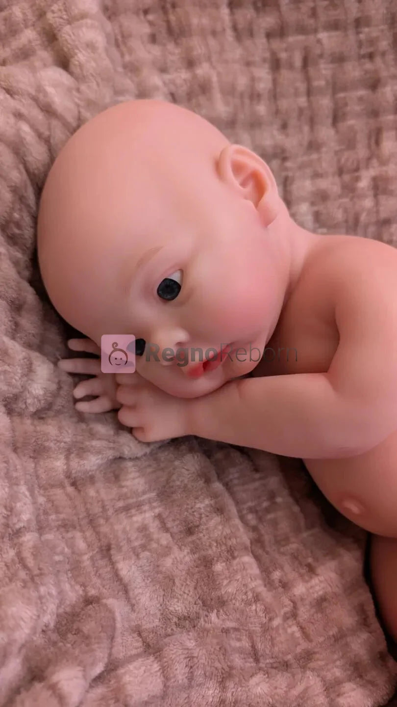bambola che sembra vera di 45cm in posizione da bebe