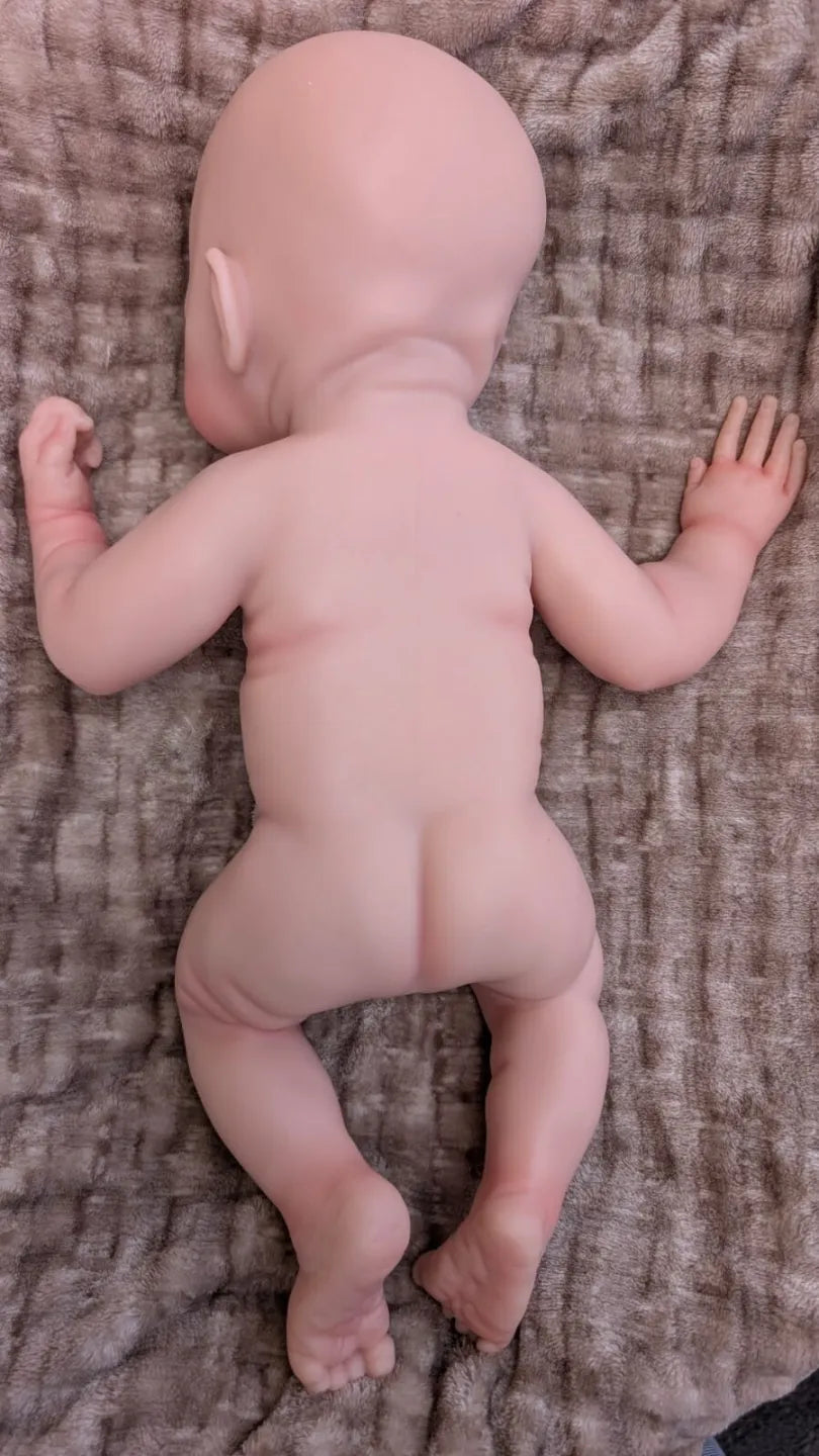 bambola reborn full silicone che pesa 3.5kg che è nuda vista posteriore