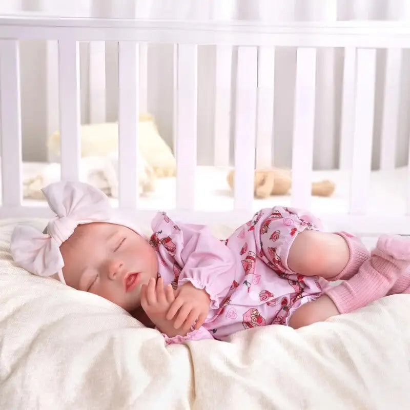 Bambola reborn femminuccia addormentata 50cm dal sorriso