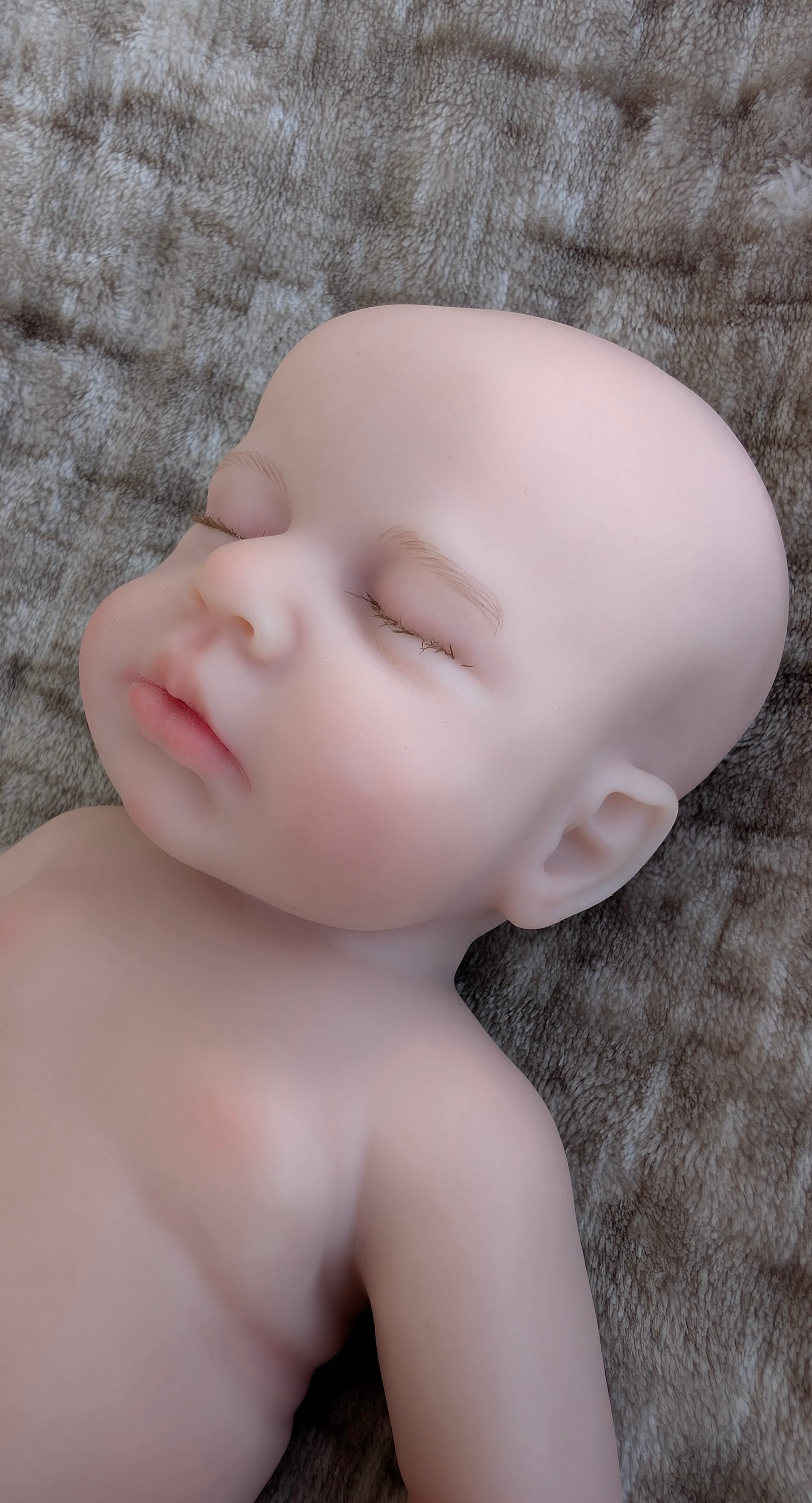 bambola-reborn-prematura-addormentata-viso-realistico-32cm