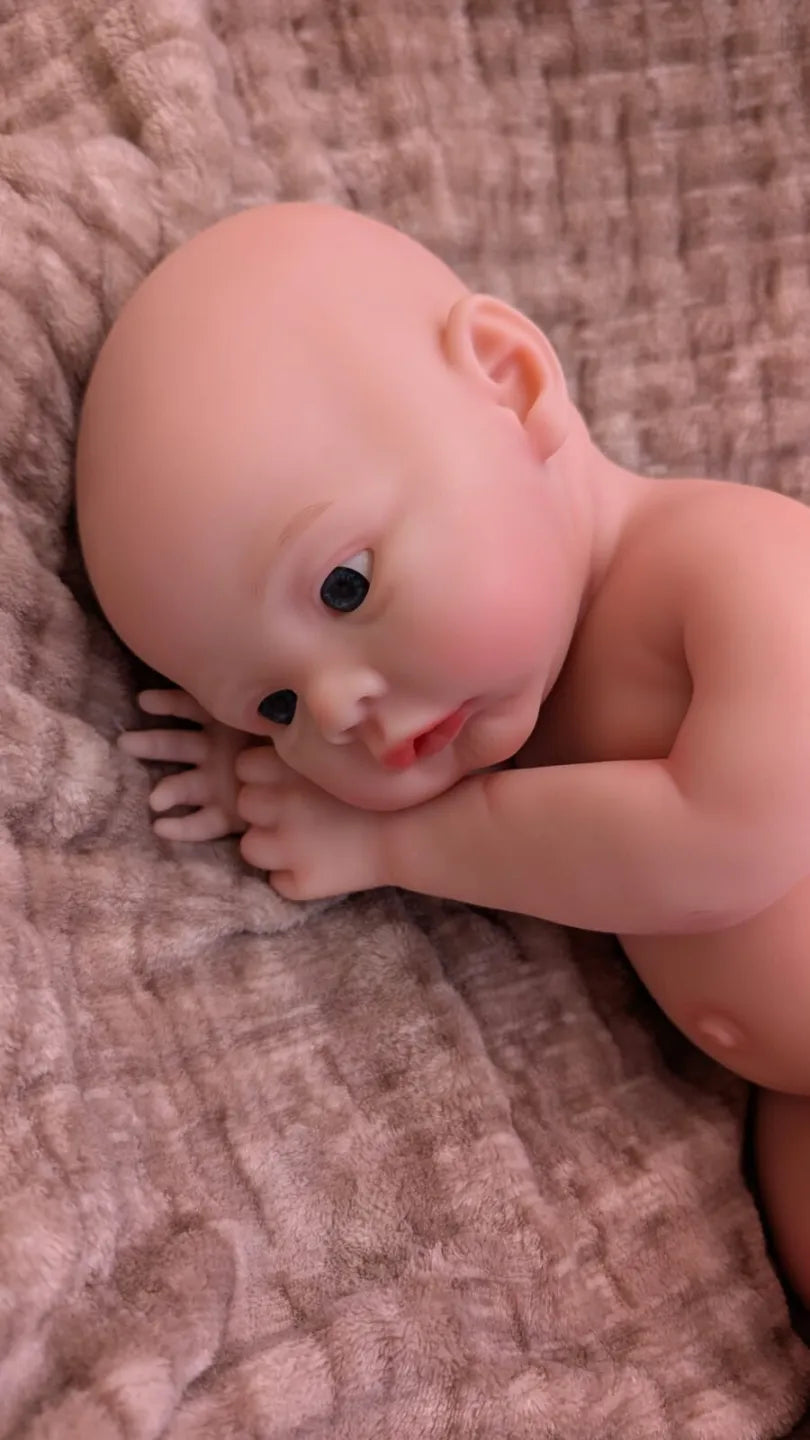 bambola che sembra vera di 45cm in posizione da bebe