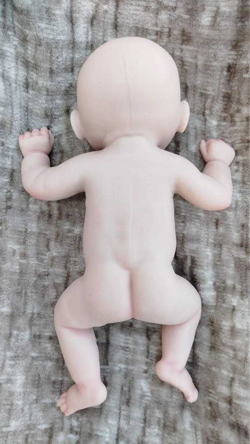 Neonato reborn femmina in silicone di 45 cm, corpo intero visto da dietro