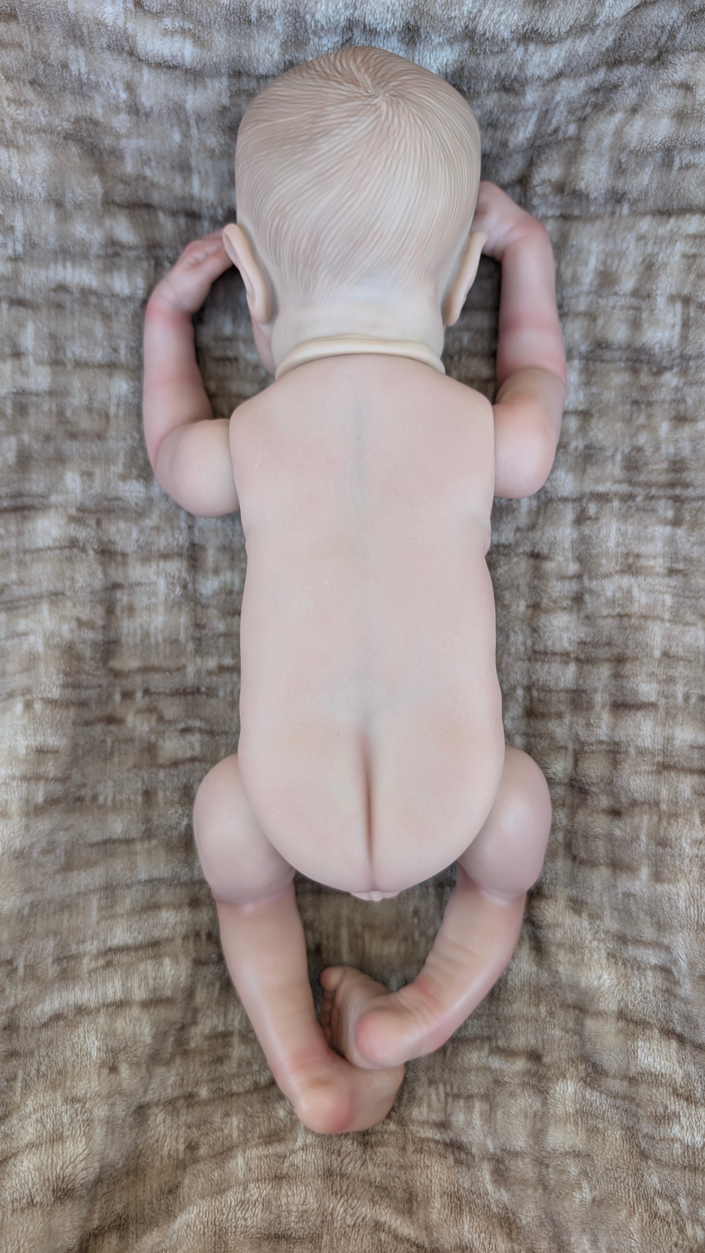 neonato-reborn-nudo-vista-dietro